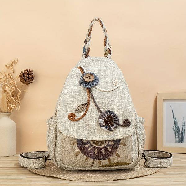 Handmade floral accent backpack with multiple compartments and features